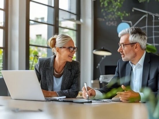 a male and female business professionals in a meeting