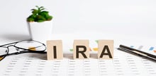 image of letters on tiles spelling IRA