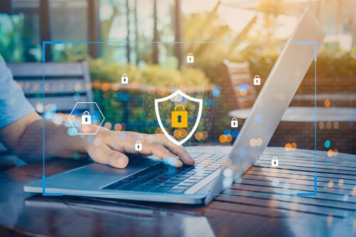 hand on keyboard with lock icon 