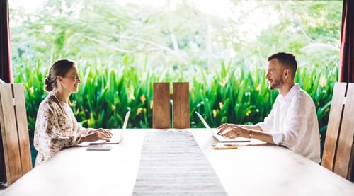 two business professionals at an outdoor table