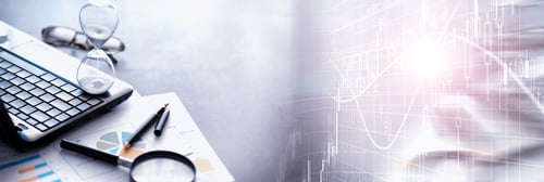 image with computer, hour glass and graph charts