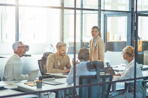 employees in a board room for a meeting