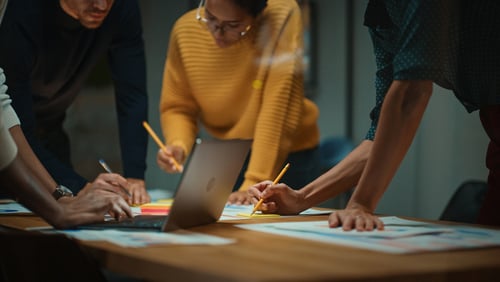 employees at a conference table working