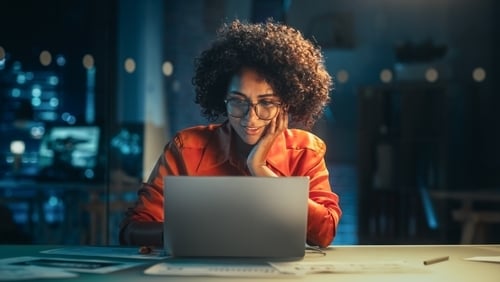 woman looking at computer screen