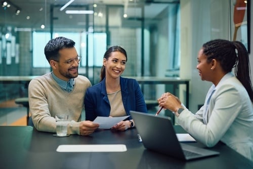 couple meeting with a business profession in office