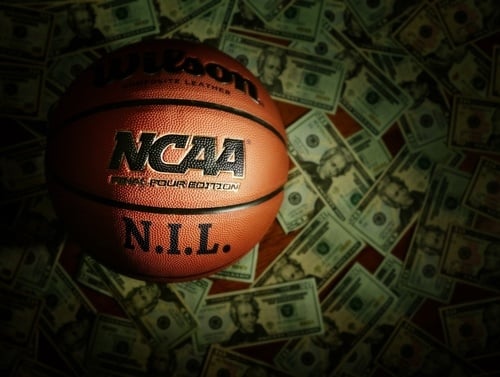 basketball with bills of money surrounding