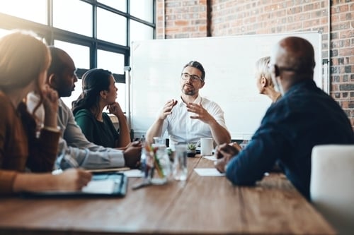 business executives in a meeting at a conference table