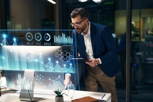 analyst looking at computer date and rate changes