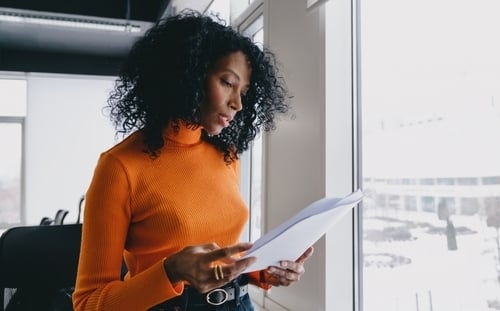 African American woman reviewing paper
