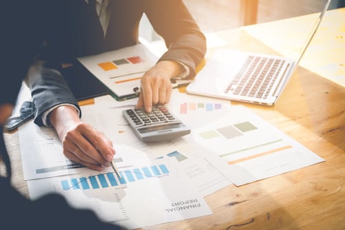 business person calculating taxes